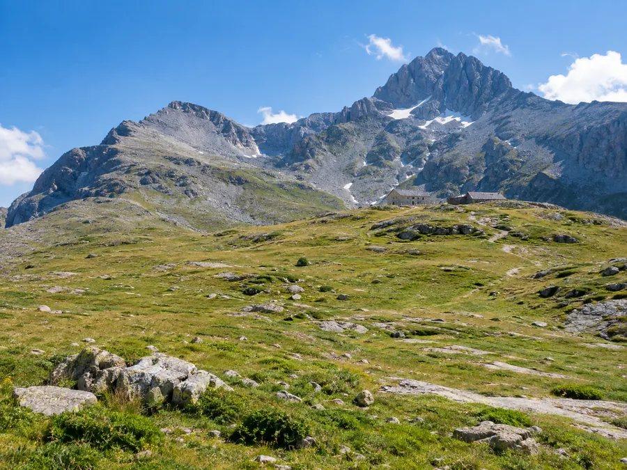 The Plateau of the Muses, a high grassy plateau below the grey summit peaks