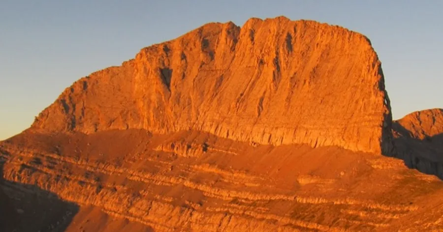 Stefani, the rock face known as the Throne of Zeus, glowing orange in evening light